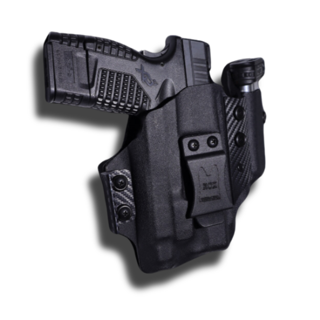 Concealed Holster with a Detachable Magazine Carrier